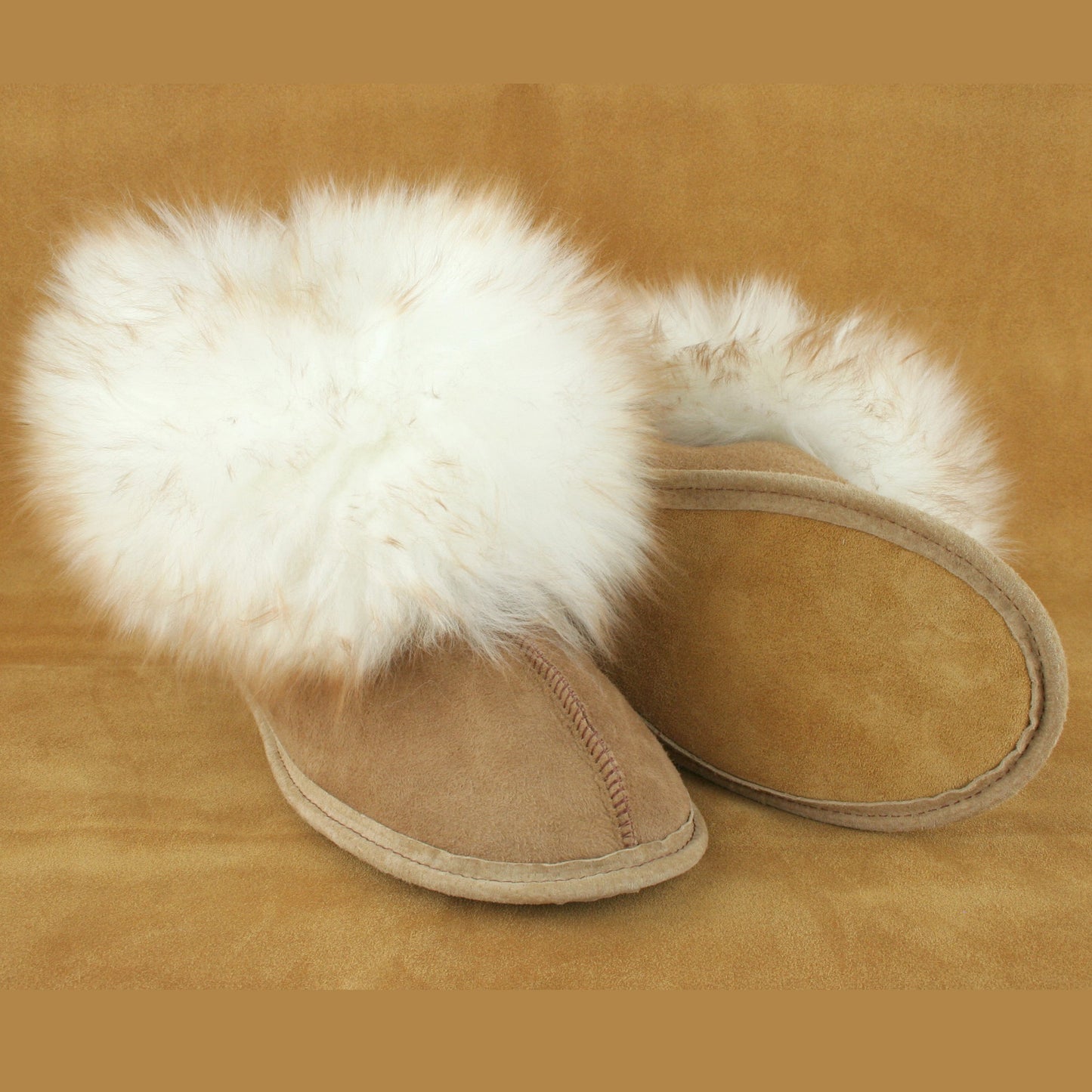 Women's cute, fluffy sheepskin slippers with soft leather sole made in USA