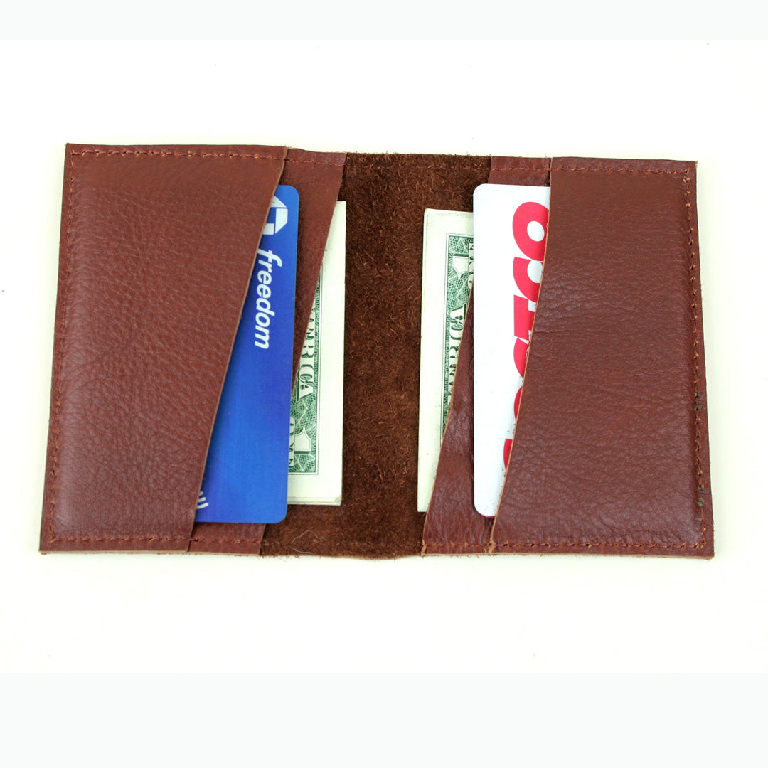 Small leather card case with space for cash.