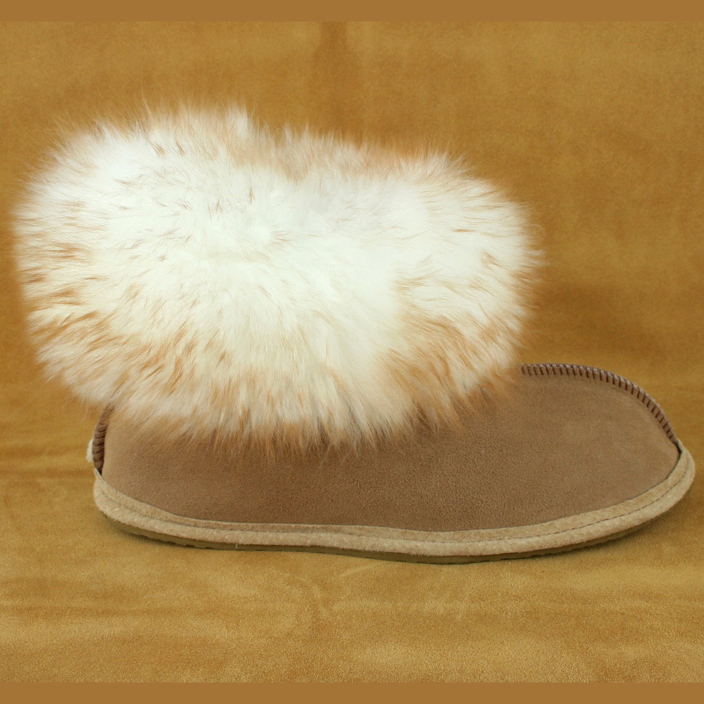 Side view of fluffy sheepskin slipper.
