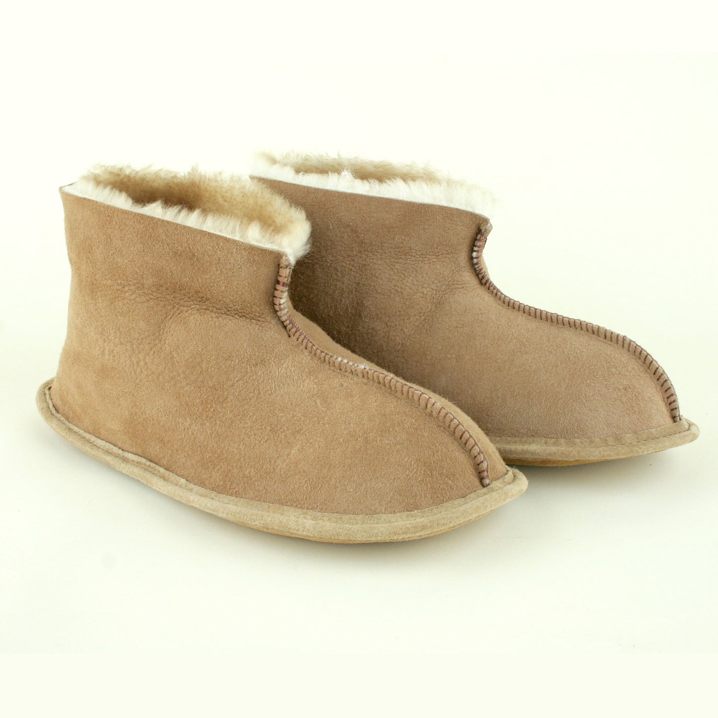 Side view of sheepskin slippers with soft leather sole made in USA.