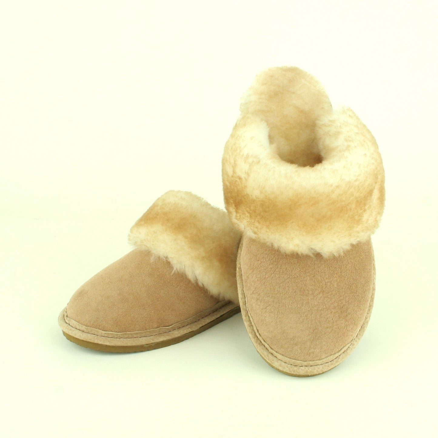 Women's sheepskin scuff style slipper with traction sole. Made in USA.