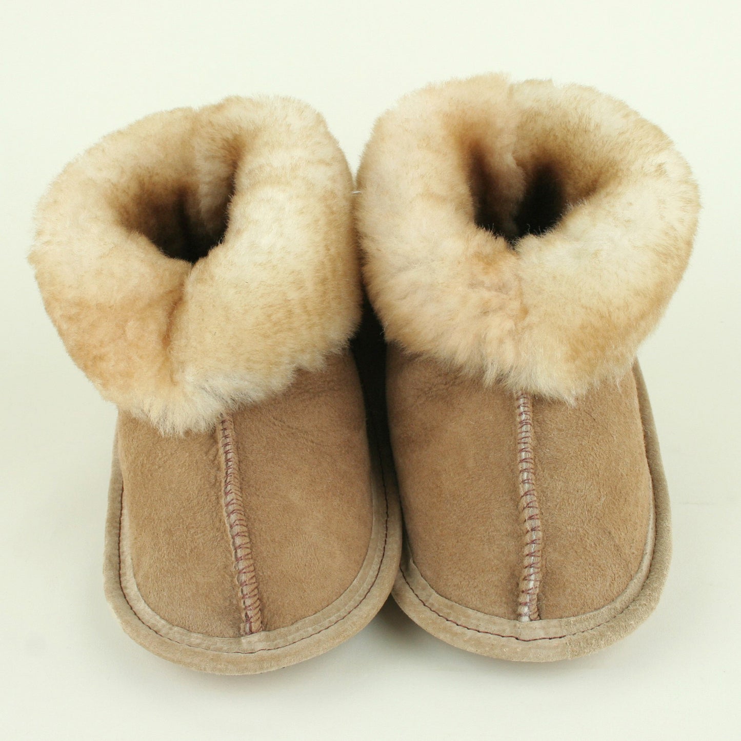 Kids sheepskin slippers with soft leather sole made in USA.