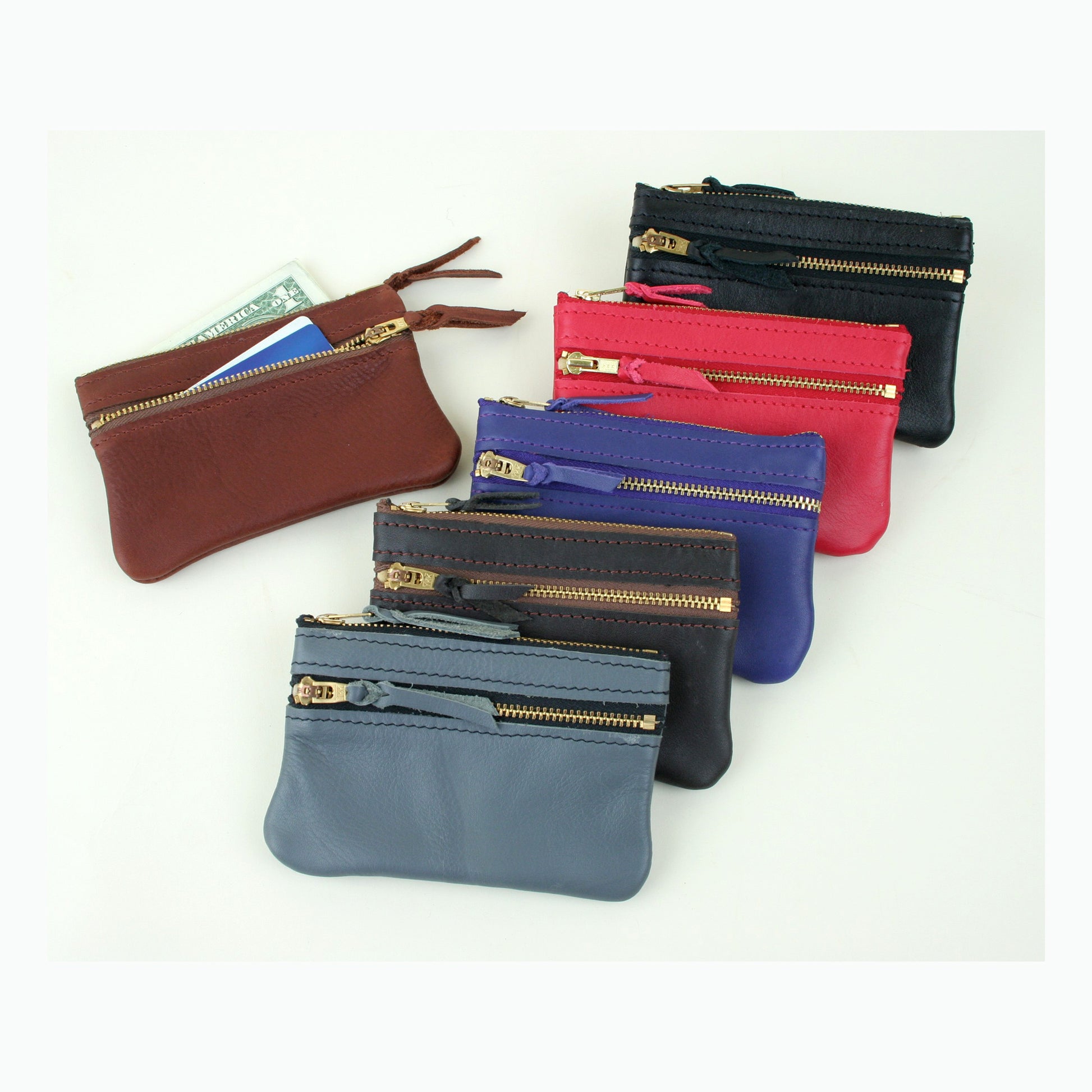 Six colors of leather coin purse with a zipper on top and a second zipper on the front. Made in USA.