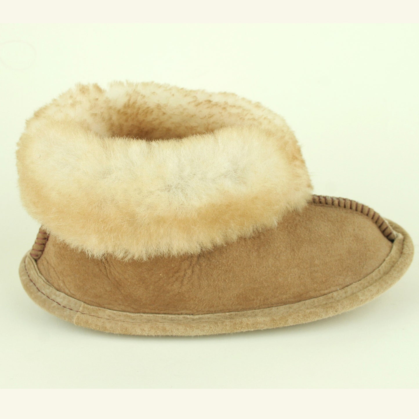 Size view of kid's sheepskin slippers with soft sole.