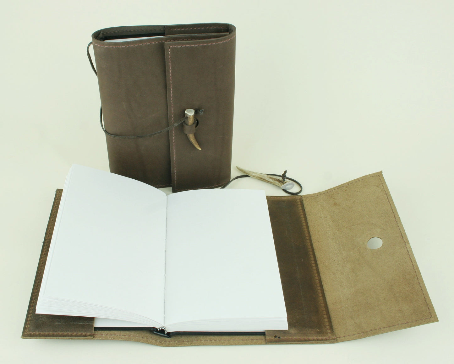Refillable leather journal with plain paper. Made in USA.