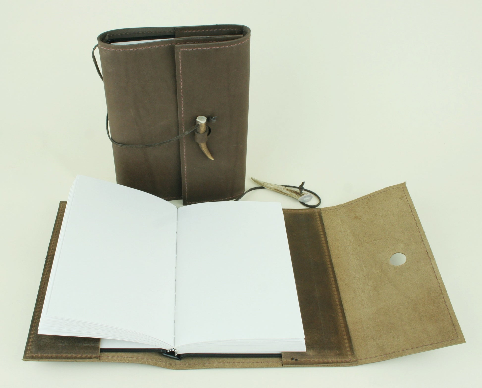 Refillable leather journal with plain paper. Made in USA.