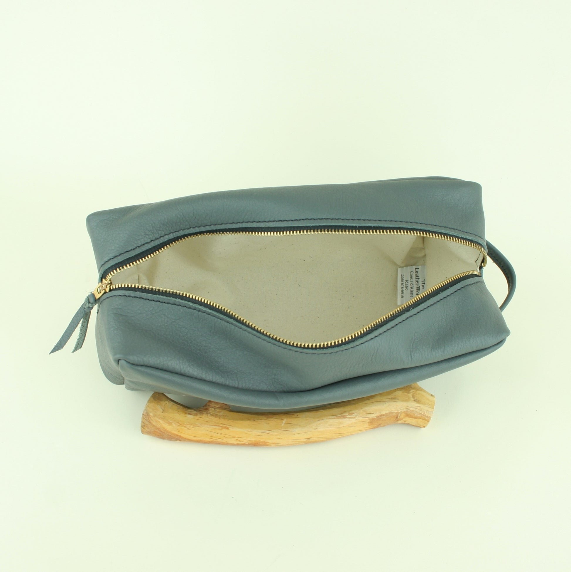 Canvas lined inside of leather travel bag.