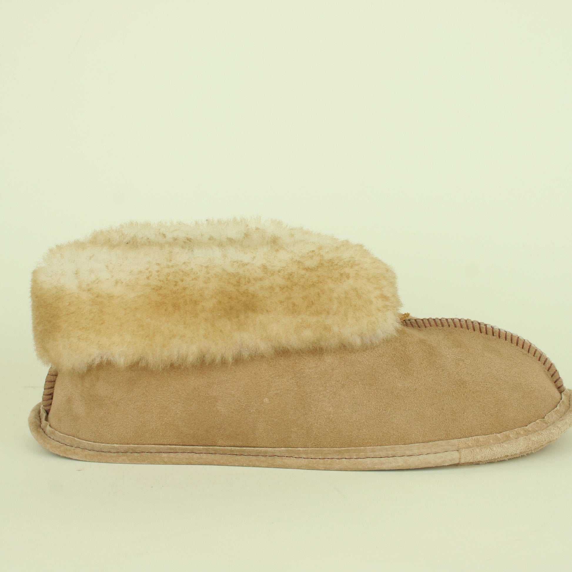 Side view of men's sheepskin slippers.