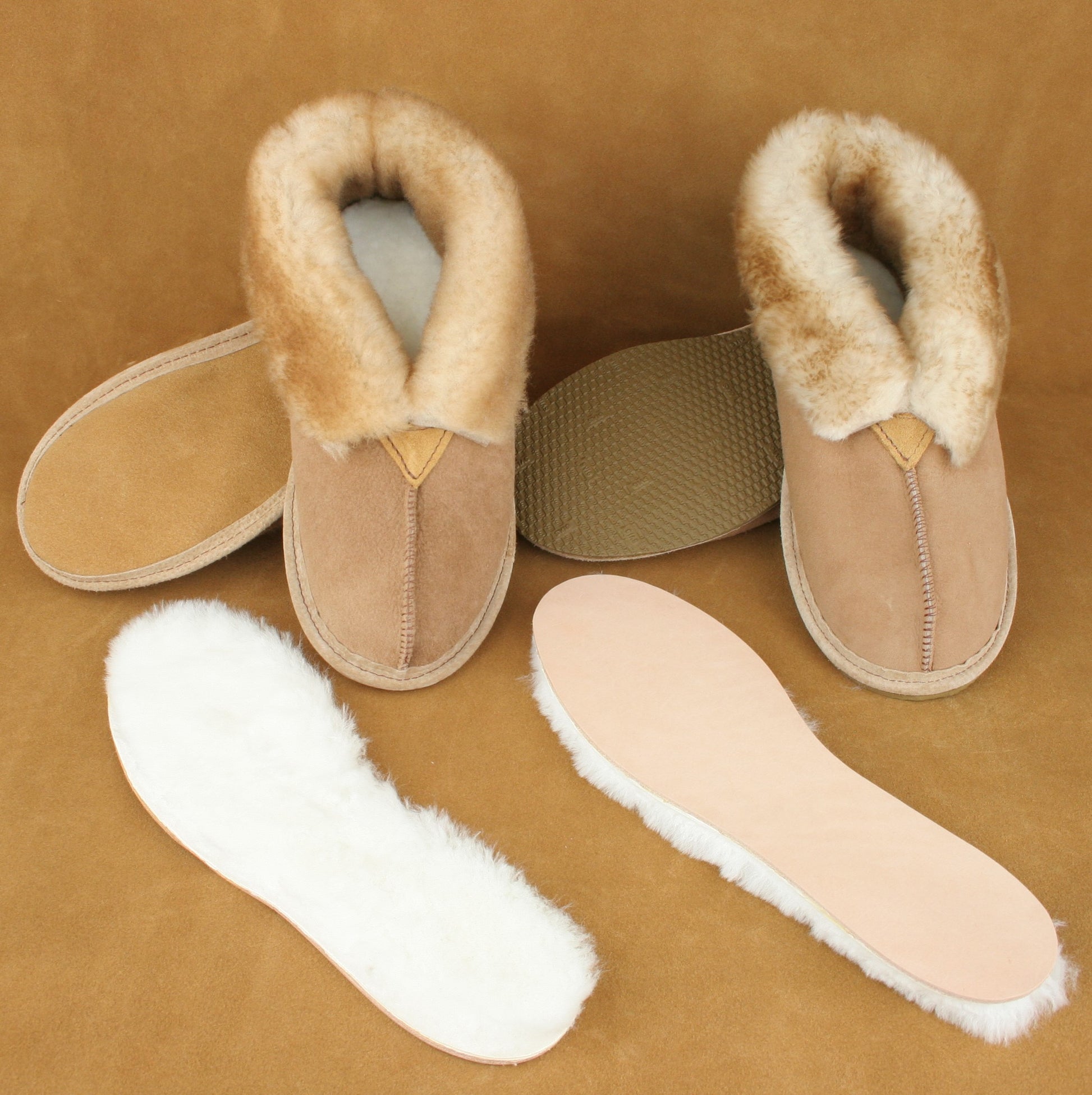Two styles of slipper with the sheepskin innersole removed.