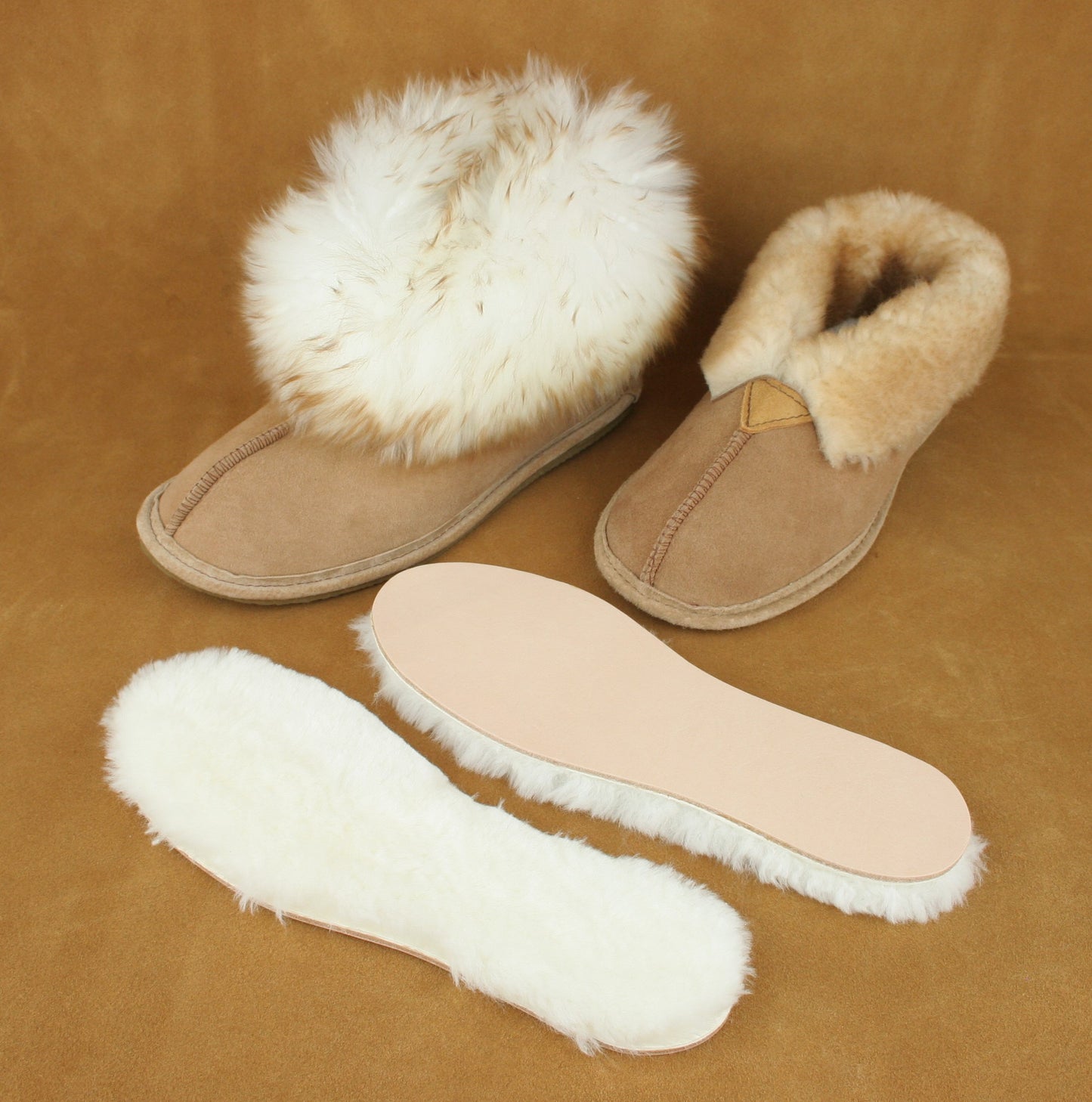 Two styles of slipper with the sheepskin innersole removed.
